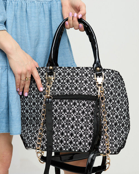 Чорно-біла блискуча жіноча сумочка